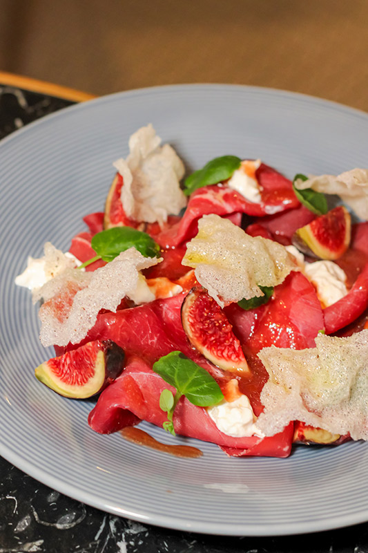 Beef carpaccio with figs and burrata